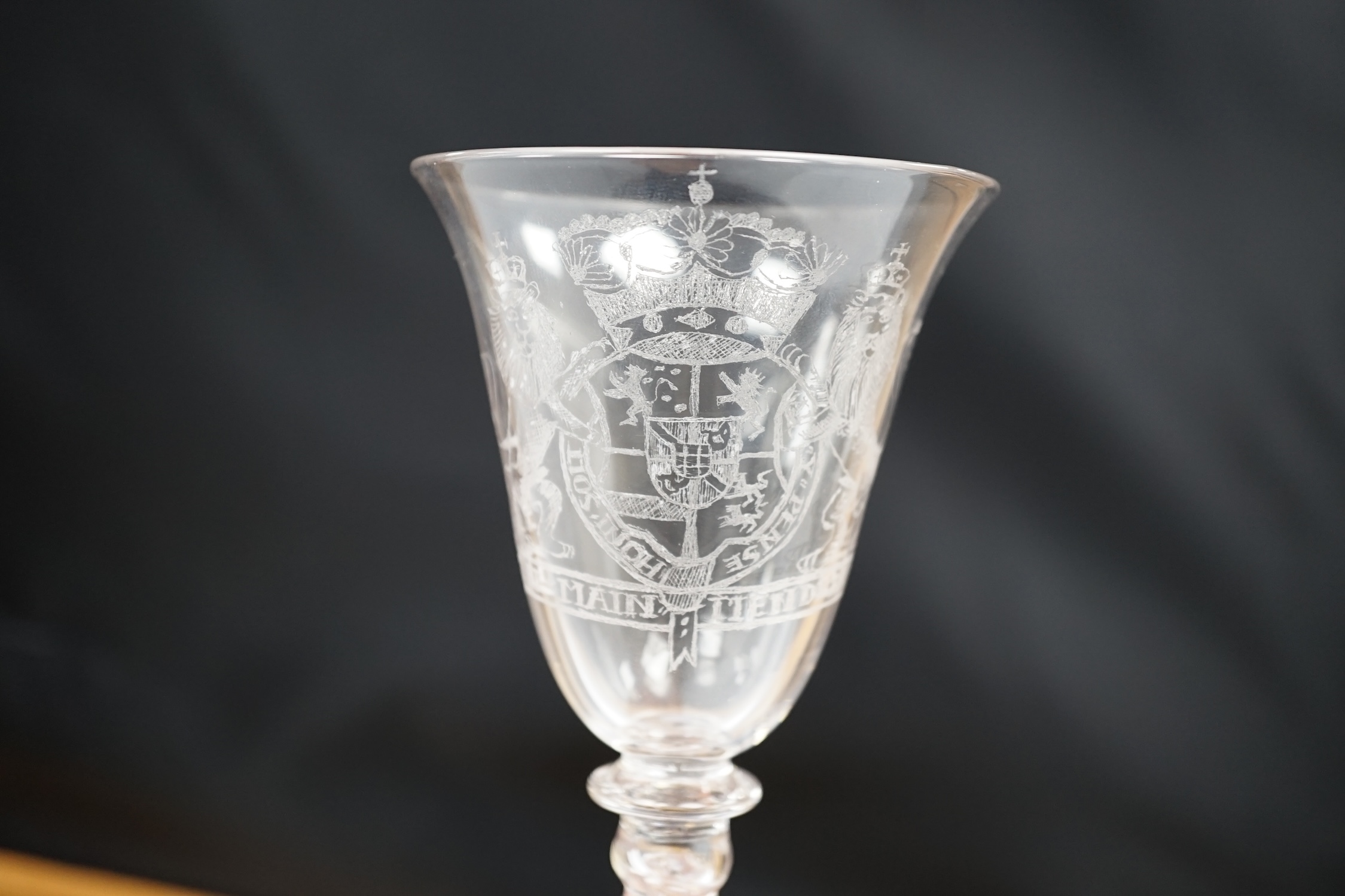 An 19th century diamond point engraved armorial glass, with knopped stem, air tears and rough pontil, 18cm